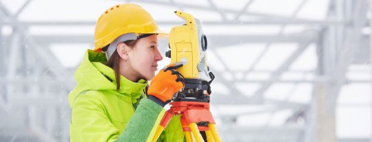 Lady in hardhat and camera