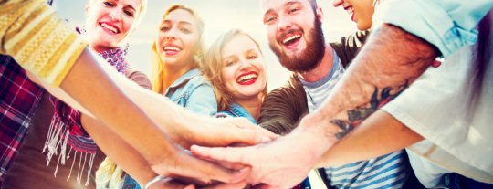 Team with hands in the middle