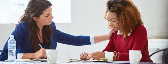 Office employees supporting each other