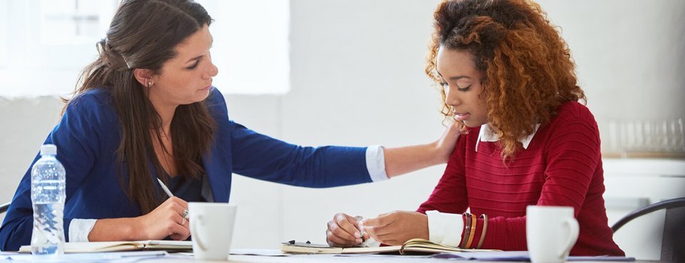 Office employees supporting each other