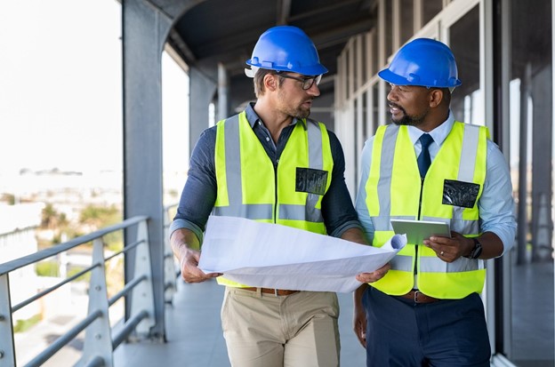 A business owner explaining his company’s safety guidelines to a contractor